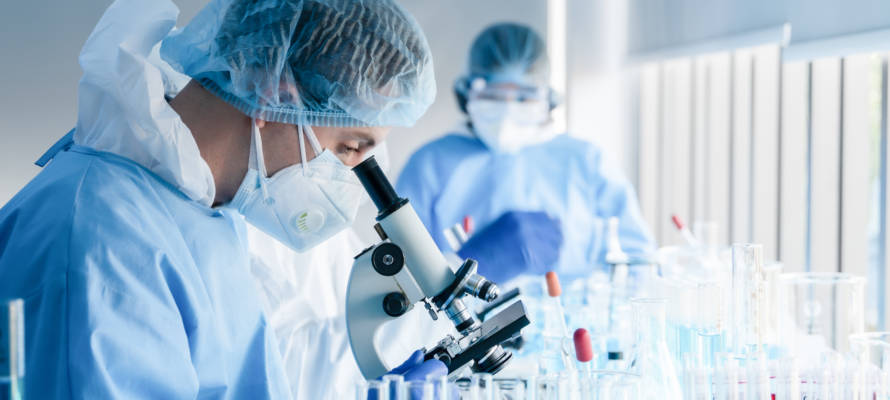 Biochemical,Research,Scientist,Team,Working,With,Microscope,For,Coronavirus,Vaccine