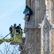 Man protesting for "Palestine" on the side of Big Ben